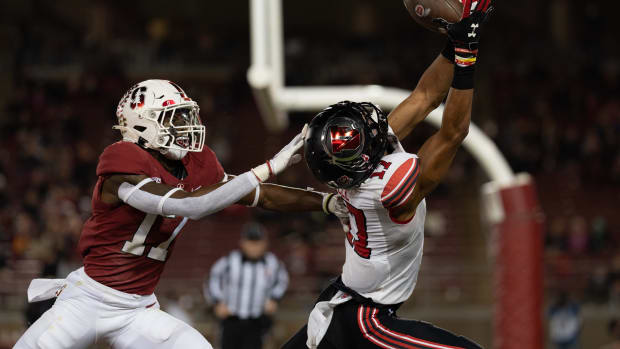 Nov 5, 2021; Stanford, California, USA; Stanford Cardinal cornerback Kyu Blu Kelly (17) attempts to defend against Utah Utes wide receiver Devaughn Vele (17) during the first quarter at Stanford Stadium. Mandatory Credit: Stan Szeto-USA TODAY Sports